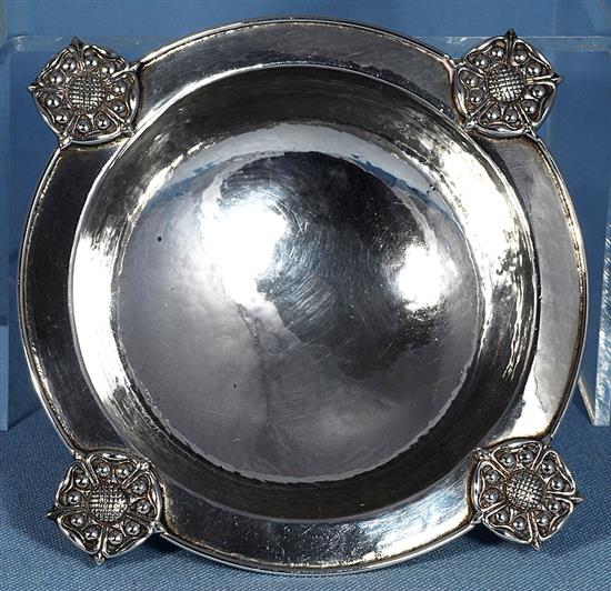 A George V Arts & Crafts silver raised circular dish, by Omar Ramsden, Dia (to Rose motifs) 165mm, weight 7.2ozs/226grms
